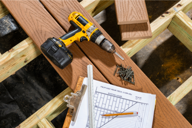 A deck being built with composite decking on pressure treated lumber